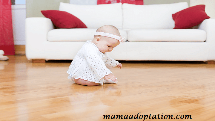 Why do some parents choose to allow their babies to crawl on the hardwood floor?